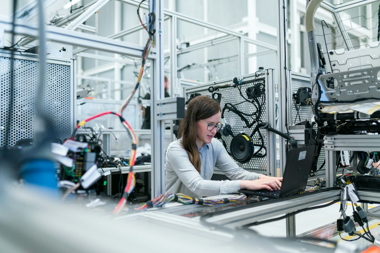 Engineer testing connected hardware in a lab